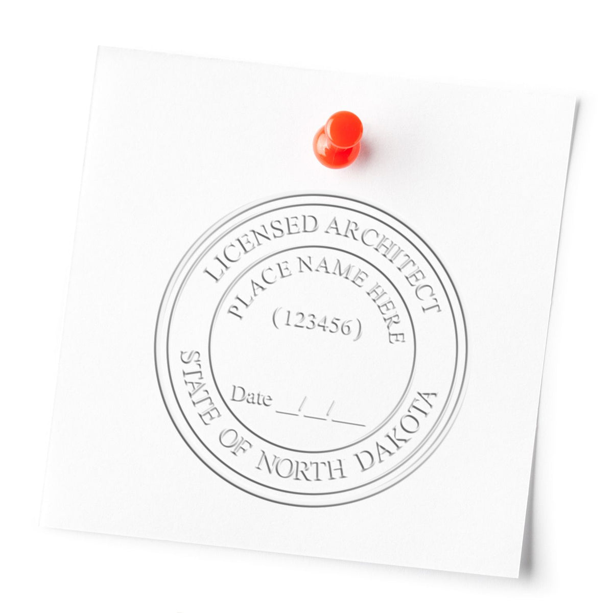 A lifestyle photo showing a stamped image of the Extended Long Reach North Dakota Architect Seal Embosser on a piece of paper