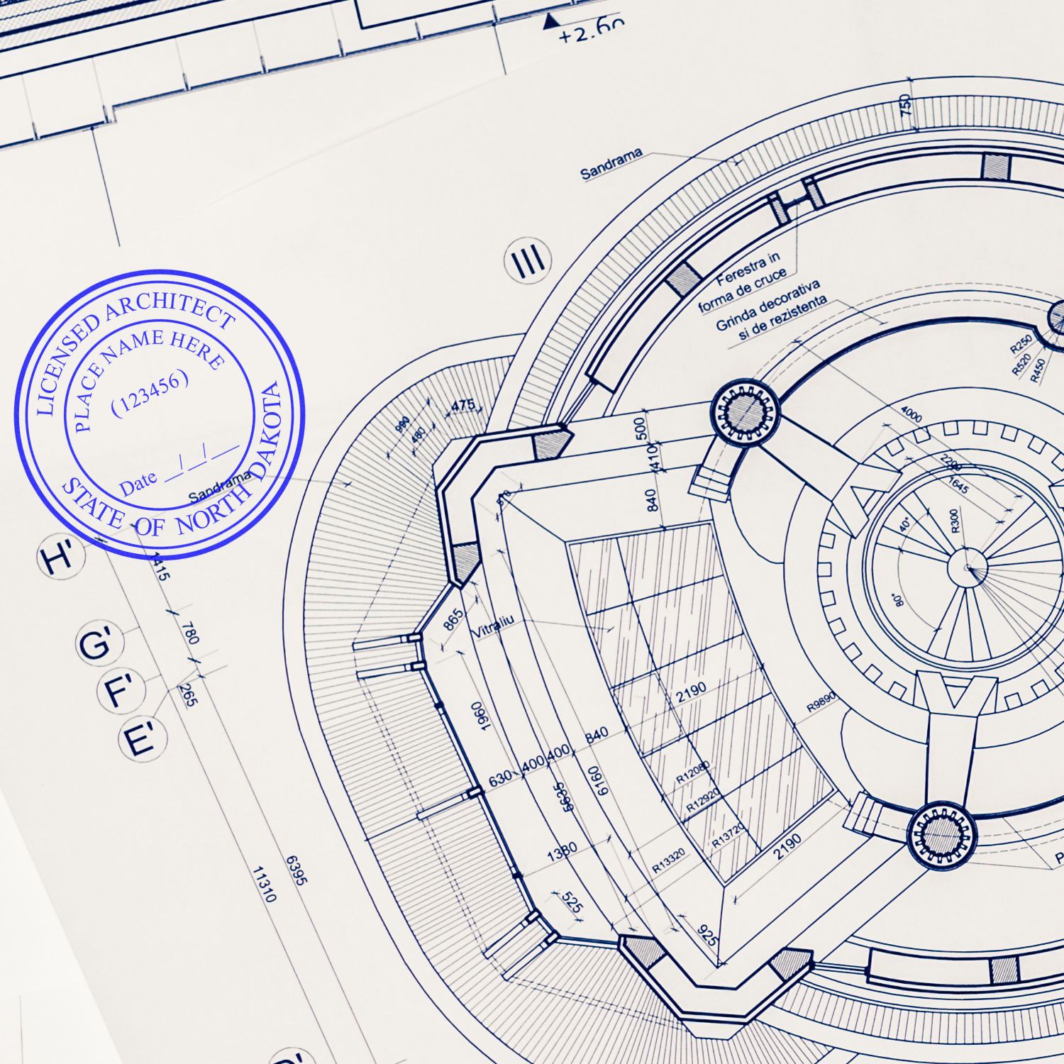 Blueprint with a North Dakota Architect Seal Stamp in blue ink, showing detailed architectural design and measurements.