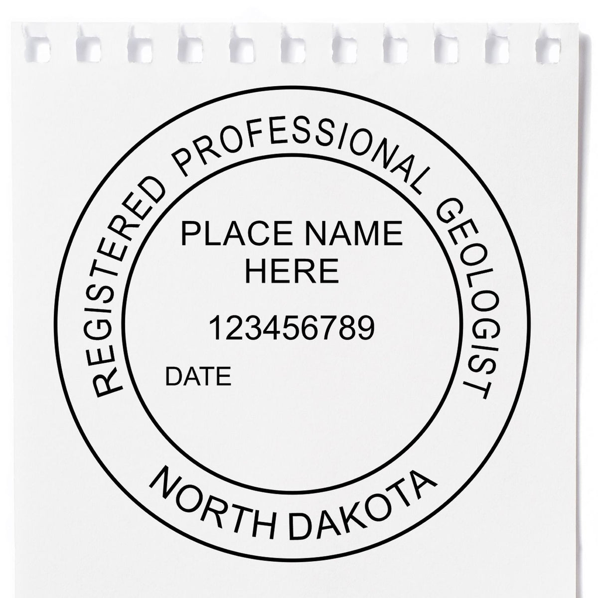 A lifestyle photo showing a stamped image of the Slim Pre-Inked North Dakota Professional Geologist Seal Stamp on a piece of paper