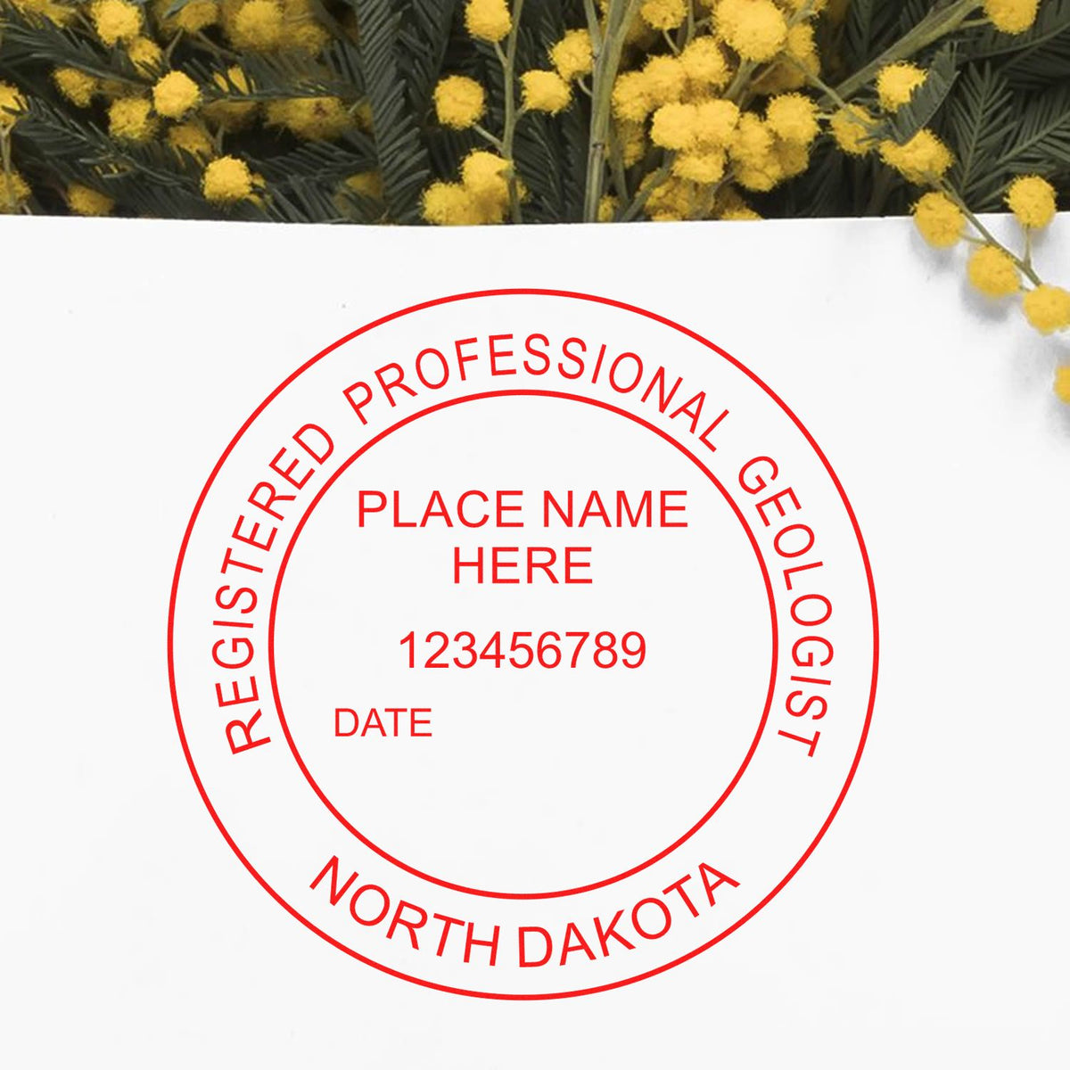 An in use photo of the North Dakota Professional Geologist Seal Stamp showing a sample imprint on a cardstock