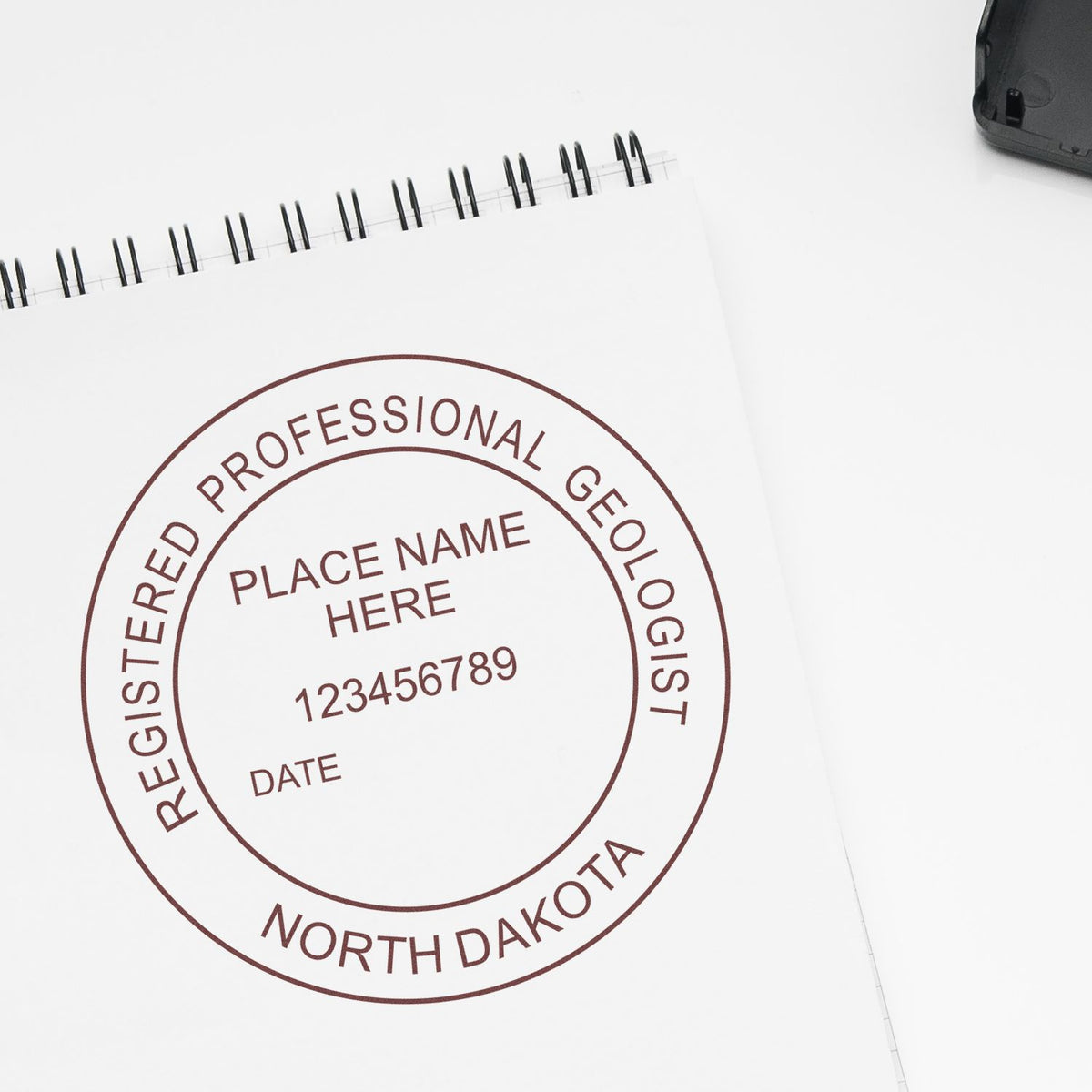 The Self-Inking North Dakota Geologist Stamp stamp impression comes to life with a crisp, detailed image stamped on paper - showcasing true professional quality.