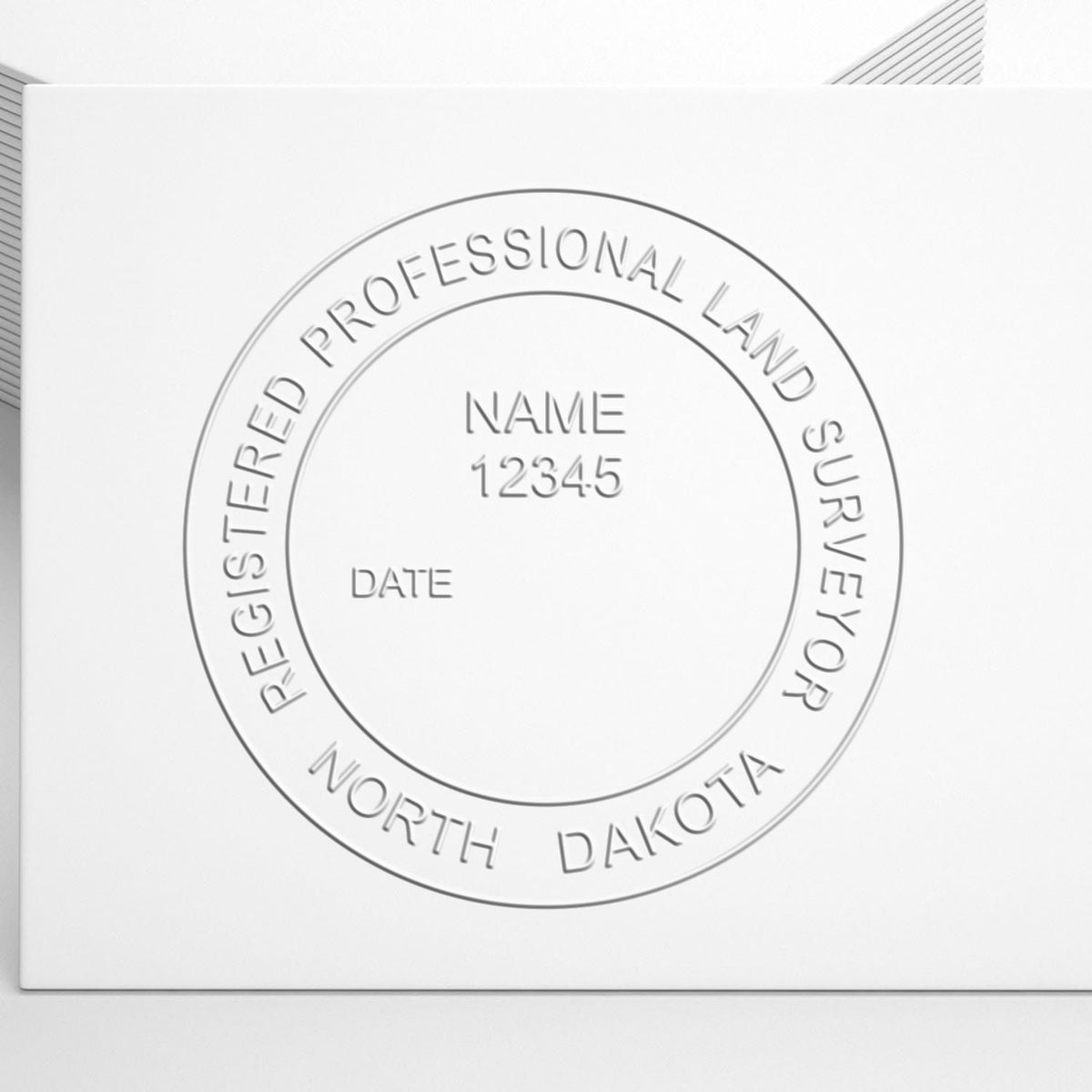 A photograph of the State of North Dakota Soft Land Surveyor Embossing Seal stamp impression reveals a vivid, professional image of the on paper.
