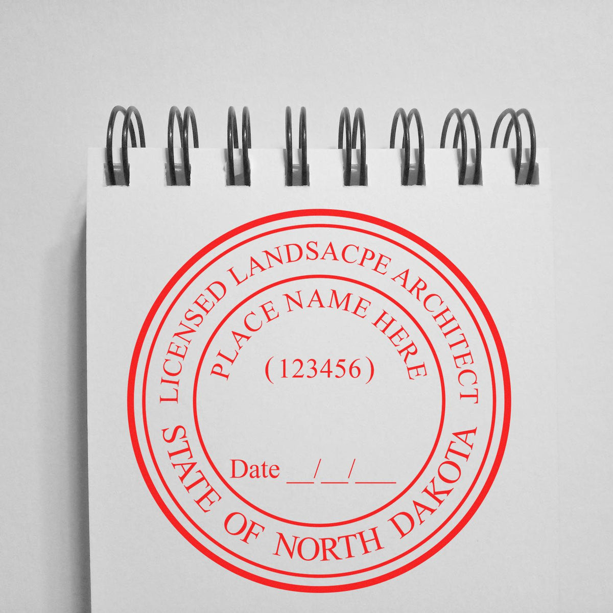 An alternative view of the Premium MaxLight Pre-Inked North Dakota Landscape Architectural Stamp stamped on a sheet of paper showing the image in use