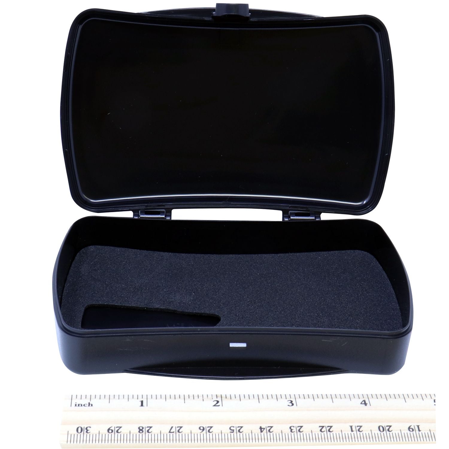 Open Notary Seal Storage Box with black interior foam padding, placed next to a ruler for size reference.