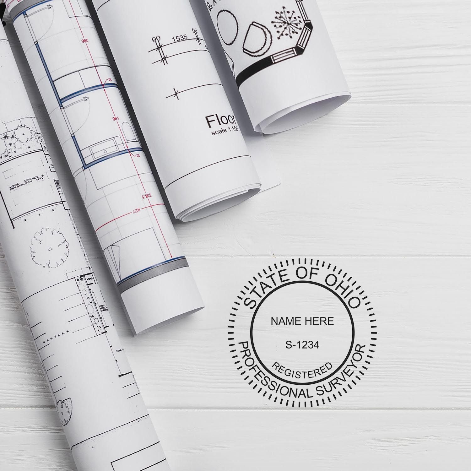 Digital Ohio Land Surveyor Stamp, Electronic Seal for Ohio Land Surveyor, shown on a white surface with architectural blueprints.