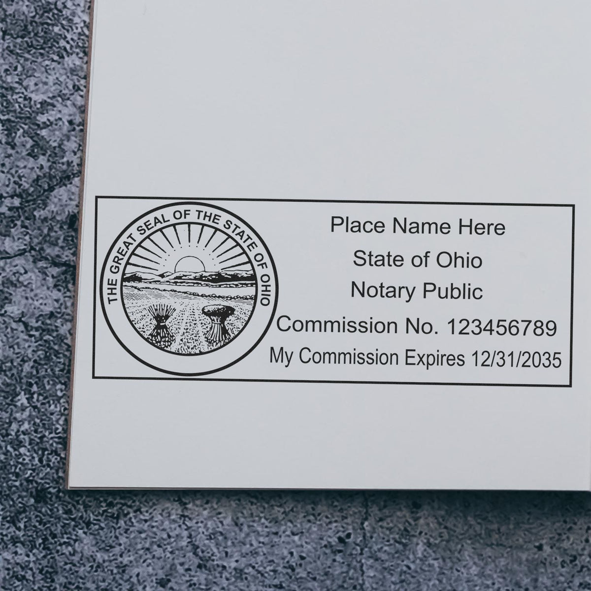 A stamped impression of the Slim Pre-Inked State Seal Notary Stamp for Ohio in this stylish lifestyle photo, setting the tone for a unique and personalized product.