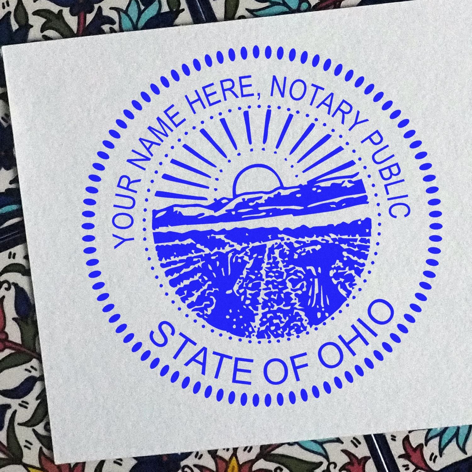 An alternative view of the Heavy-Duty Round Ohio Notary Stamp stamped on a sheet of paper showing the image in use