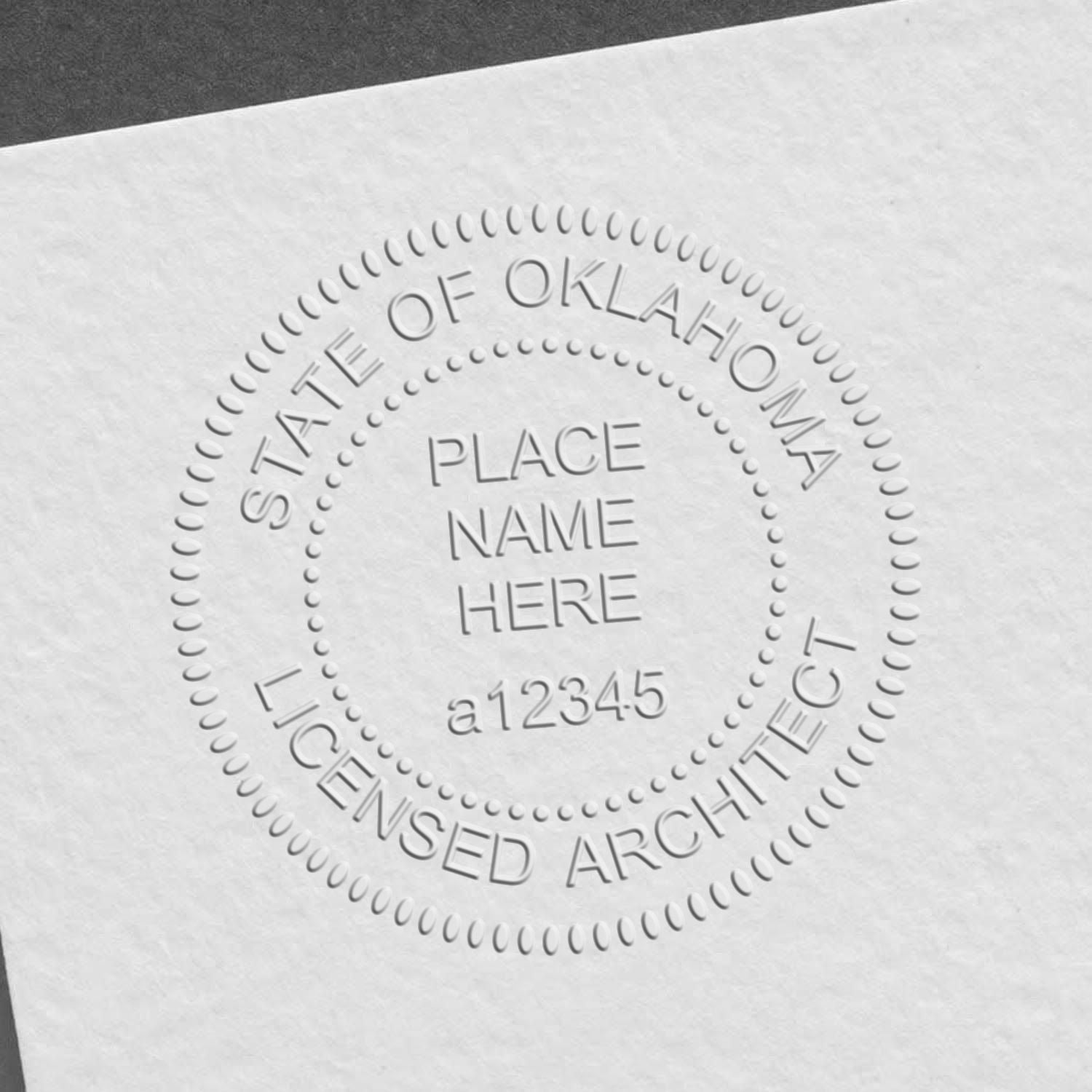 Another Example of a stamped impression of the Heavy Duty Cast Iron Oklahoma Architect Embosser on a piece of office paper.