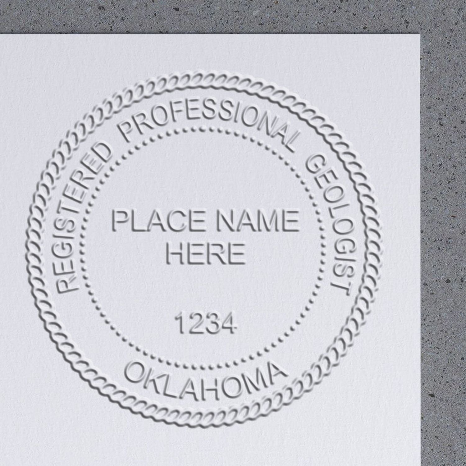 The main image for the Heavy Duty Cast Iron Oklahoma Geologist Seal Embosser depicting a sample of the imprint and imprint sample