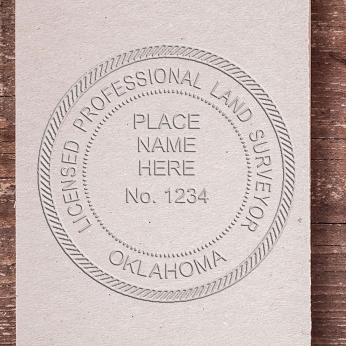 A lifestyle photo showing a stamped image of the State of Oklahoma Soft Land Surveyor Embossing Seal on a piece of paper