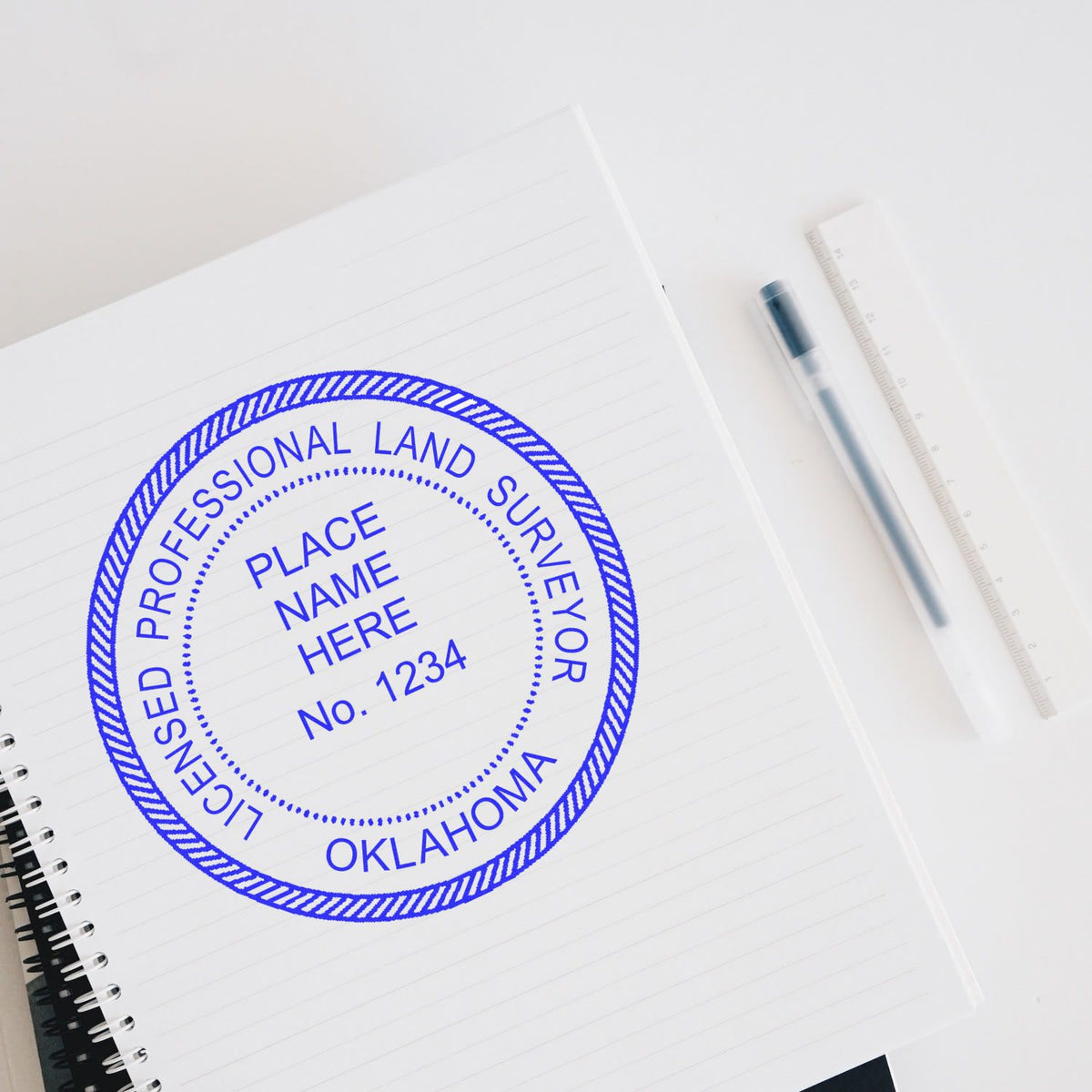 A lifestyle photo showing a stamped image of the Slim Pre-Inked Oklahoma Land Surveyor Seal Stamp on a piece of paper
