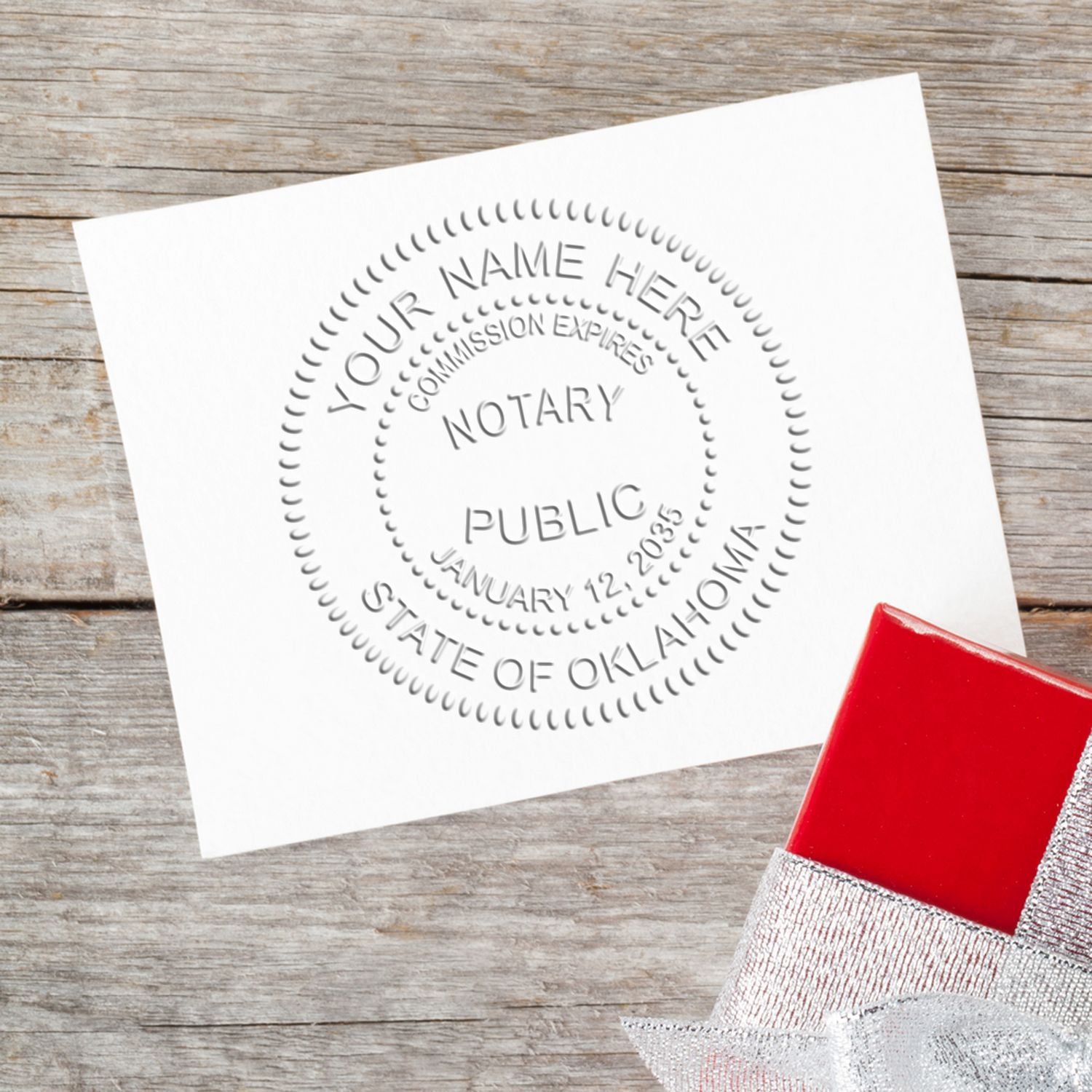 A lifestyle photo showing a stamped image of the Soft Seal Oklahoma Notary Seal on a piece of paper