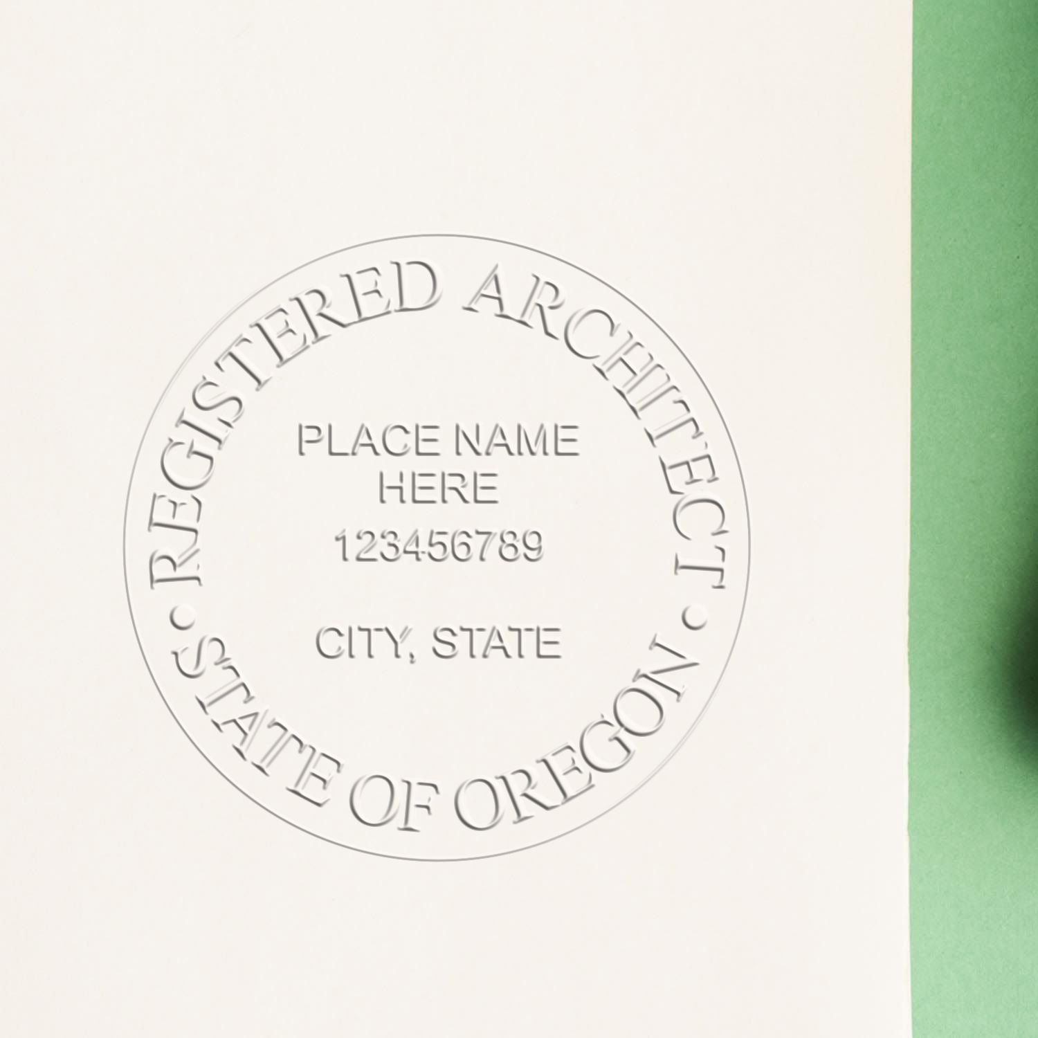 A stamped impression of the Handheld Oregon Architect Seal Embosser in this stylish lifestyle photo, setting the tone for a unique and personalized product.