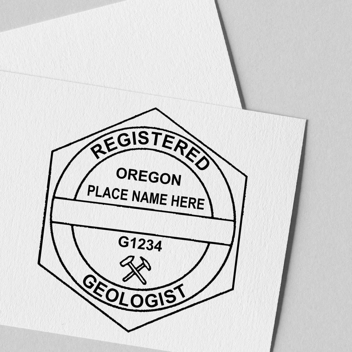 A lifestyle photo showing a stamped image of the Slim Pre-Inked Oregon Professional Geologist Seal Stamp on a piece of paper