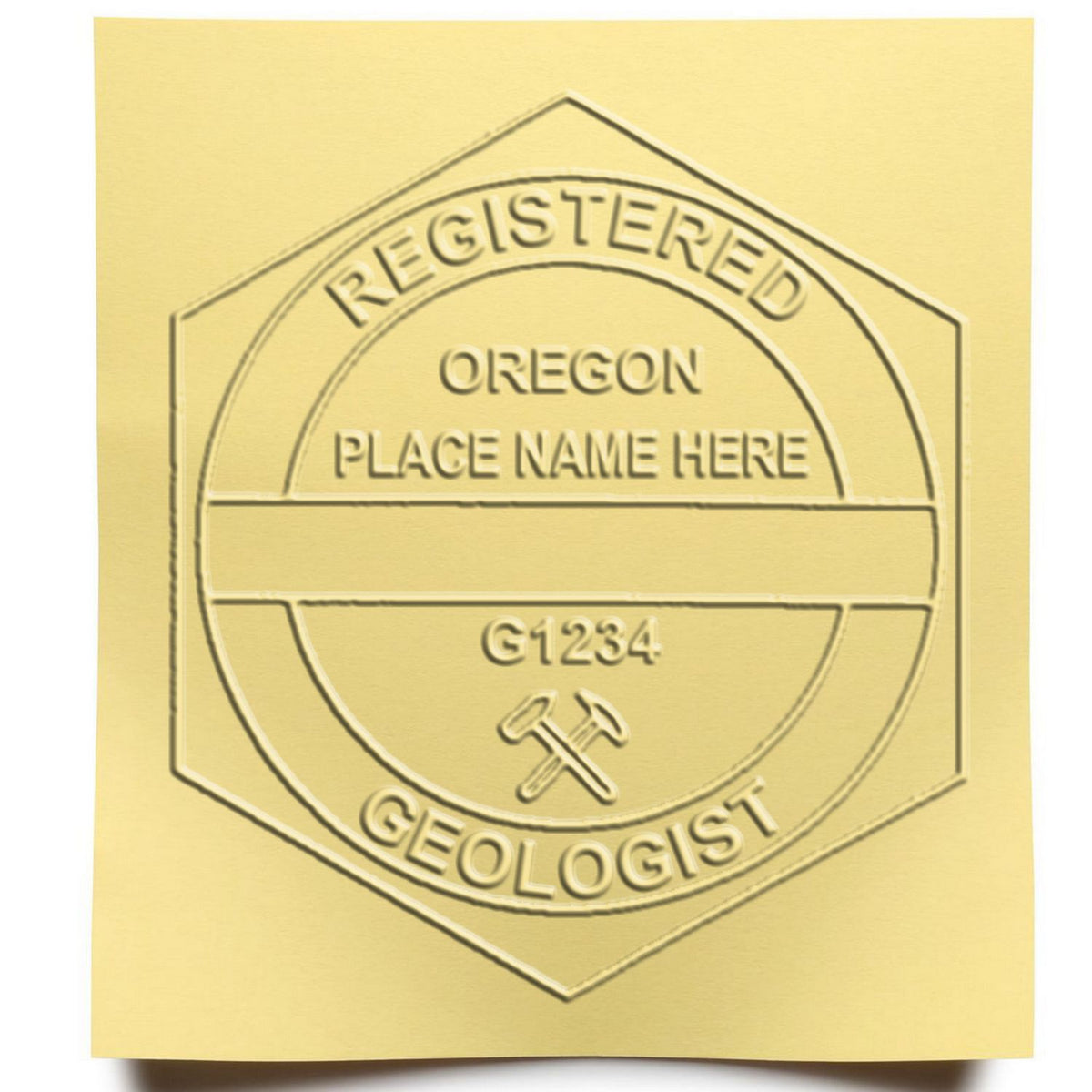 A lifestyle photo showing a stamped image of the Heavy Duty Cast Iron Oregon Geologist Seal Embosser on a piece of paper
