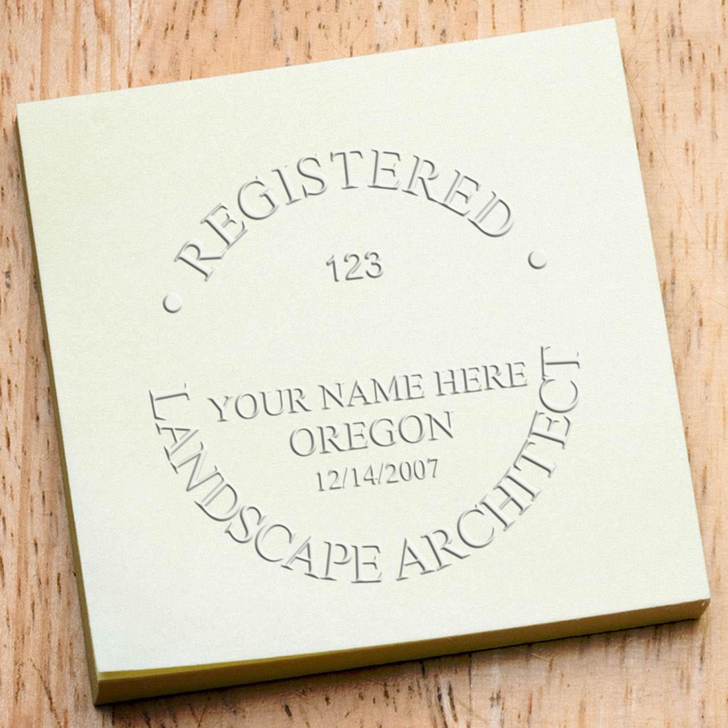 A stamped impression of the State of Oregon Handheld Landscape Architect Seal in this stylish lifestyle photo, setting the tone for a unique and personalized product.