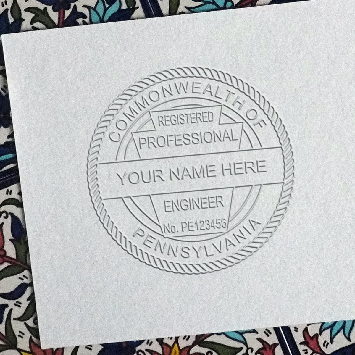 A stamped impression of the Soft Pennsylvania Professional Engineer Seal in this stylish lifestyle photo, setting the tone for a unique and personalized product.