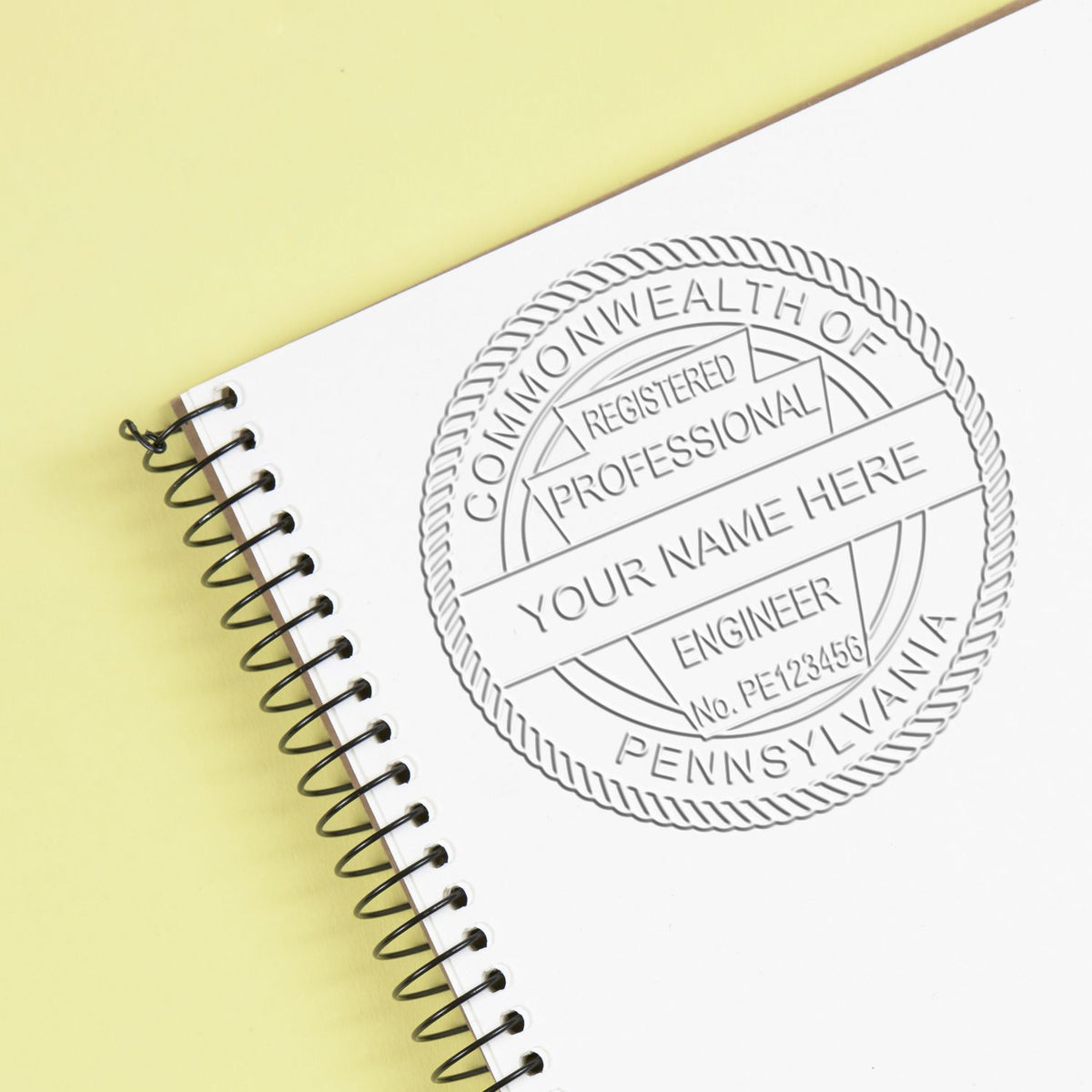 The Gift Pennsylvania Engineer Seal stamp impression comes to life with a crisp, detailed image stamped on paper - showcasing true professional quality.