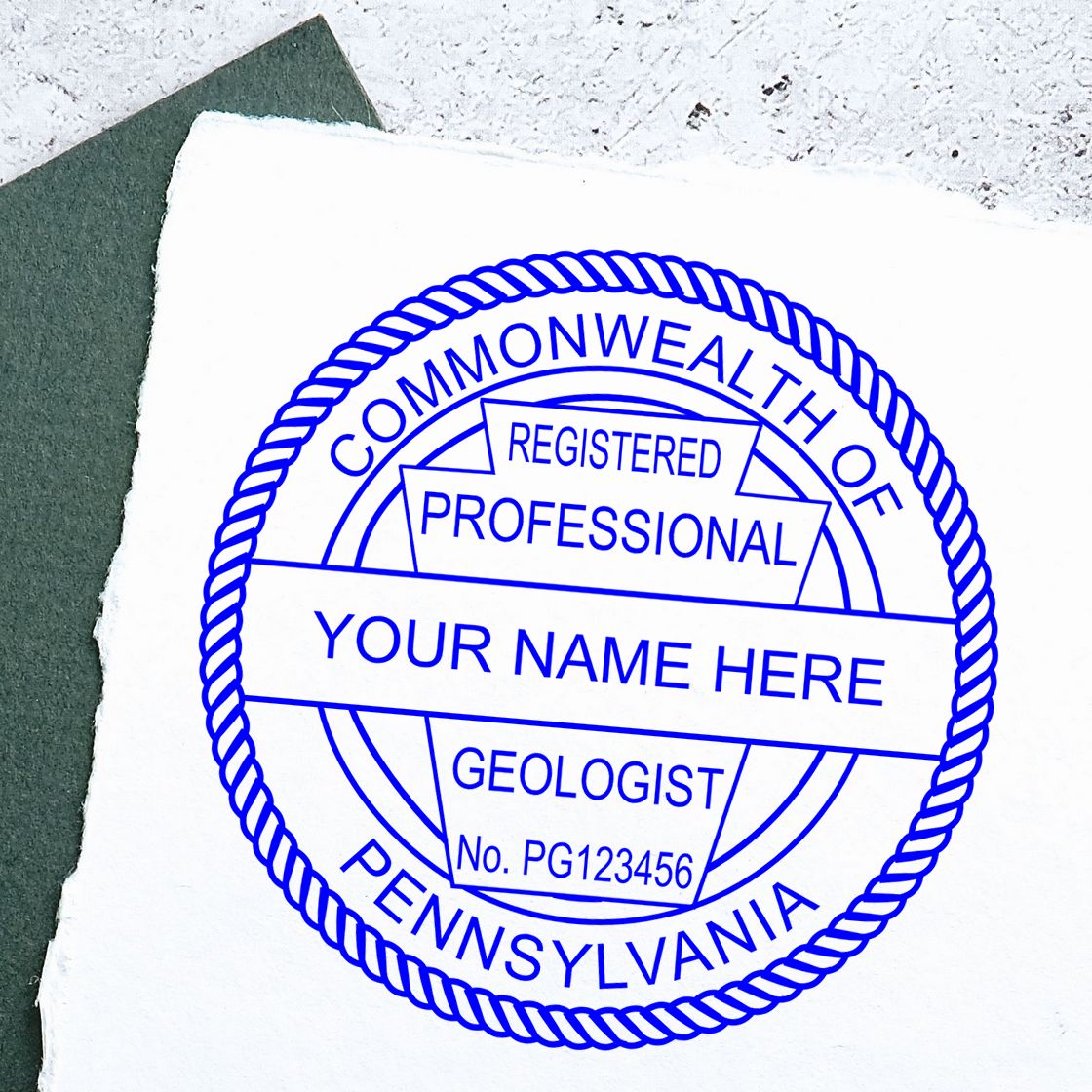 A stamped imprint of the Pennsylvania Professional Geologist Seal Stamp in this stylish lifestyle photo, setting the tone for a unique and personalized product.