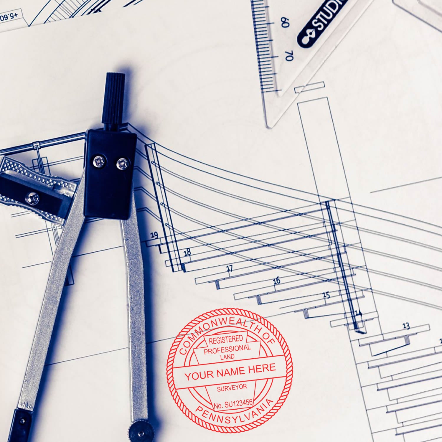 Premium MaxLight Pre-Inked Pennsylvania Surveyors Stamp on architectural blueprints with drafting tools.