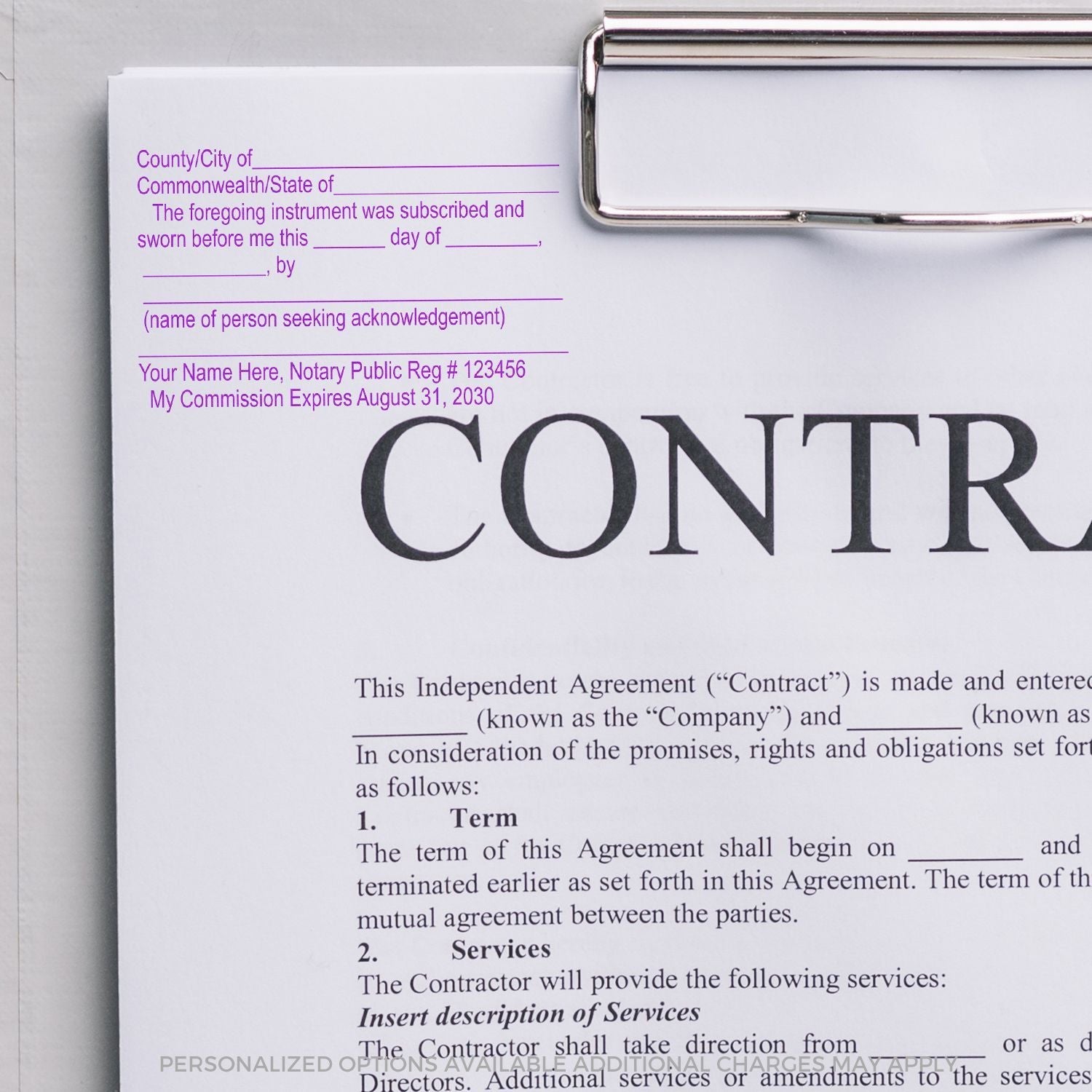 A Slim Pre-Inked Notary Jurat Stamp is used on a document attached to a clipboard, showing a notary section filled out with details.