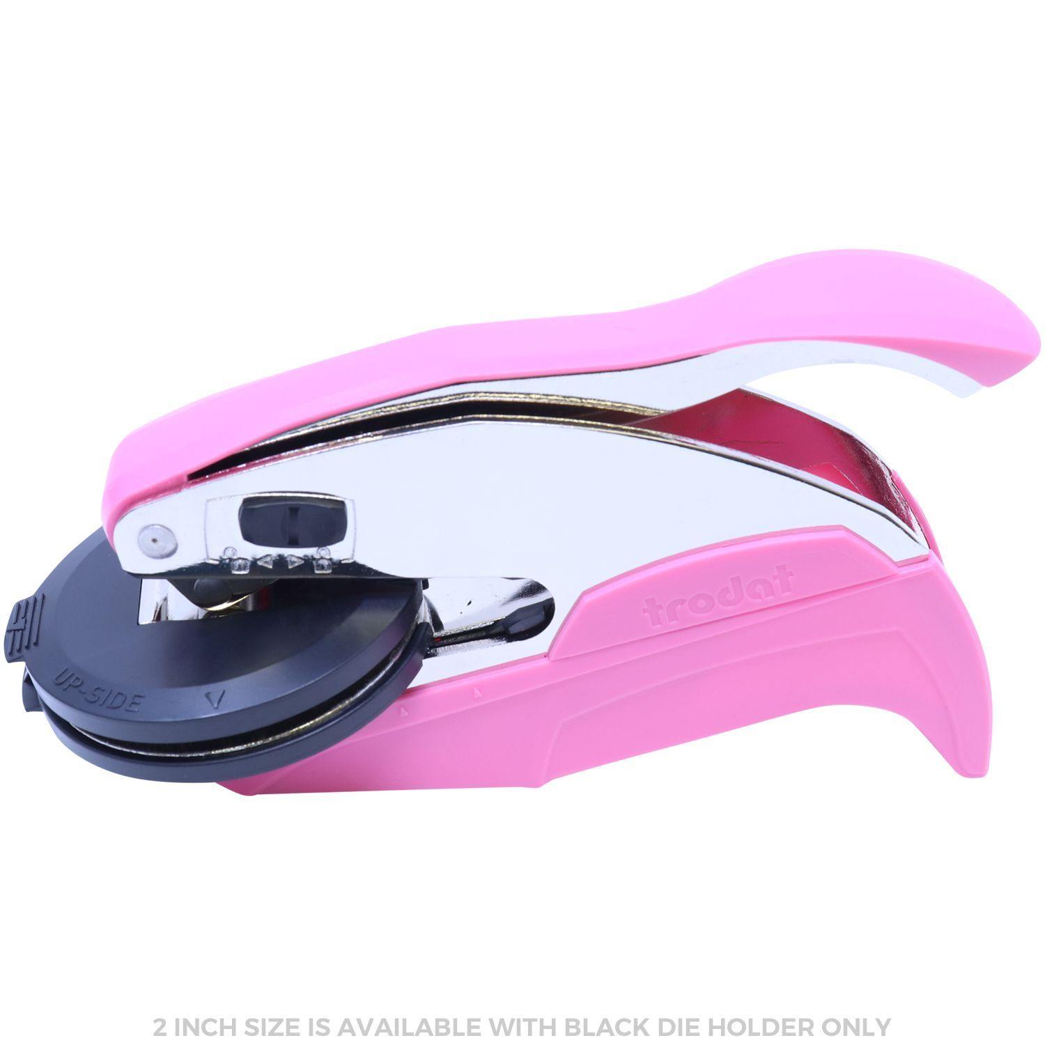 Forester Pink Hybrid Handheld Embosser with a sleek design, featuring a pink handle and a 2-inch black die holder, shown from the side.