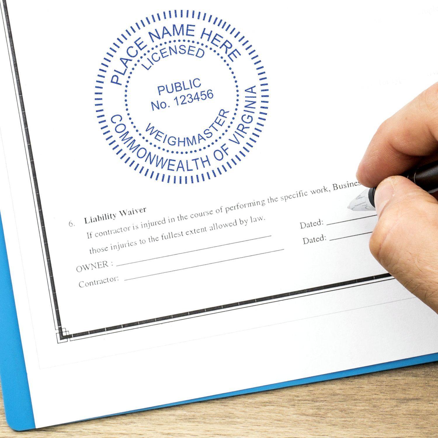 Hand stamping a document with the Public Weighmaster Regular Rubber Stamp of Seal, showing a blue circular seal on a liability waiver form.