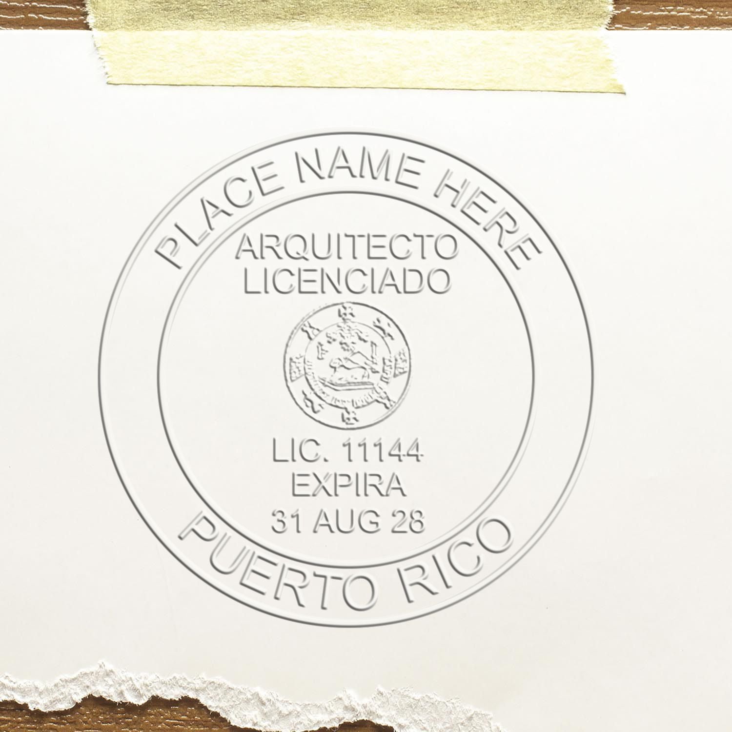 Extended Long Reach Puerto Rico Architect Seal Embosser in use photo showing a stamped imprint of the Extended Long Reach Puerto Rico Architect Seal Embosser