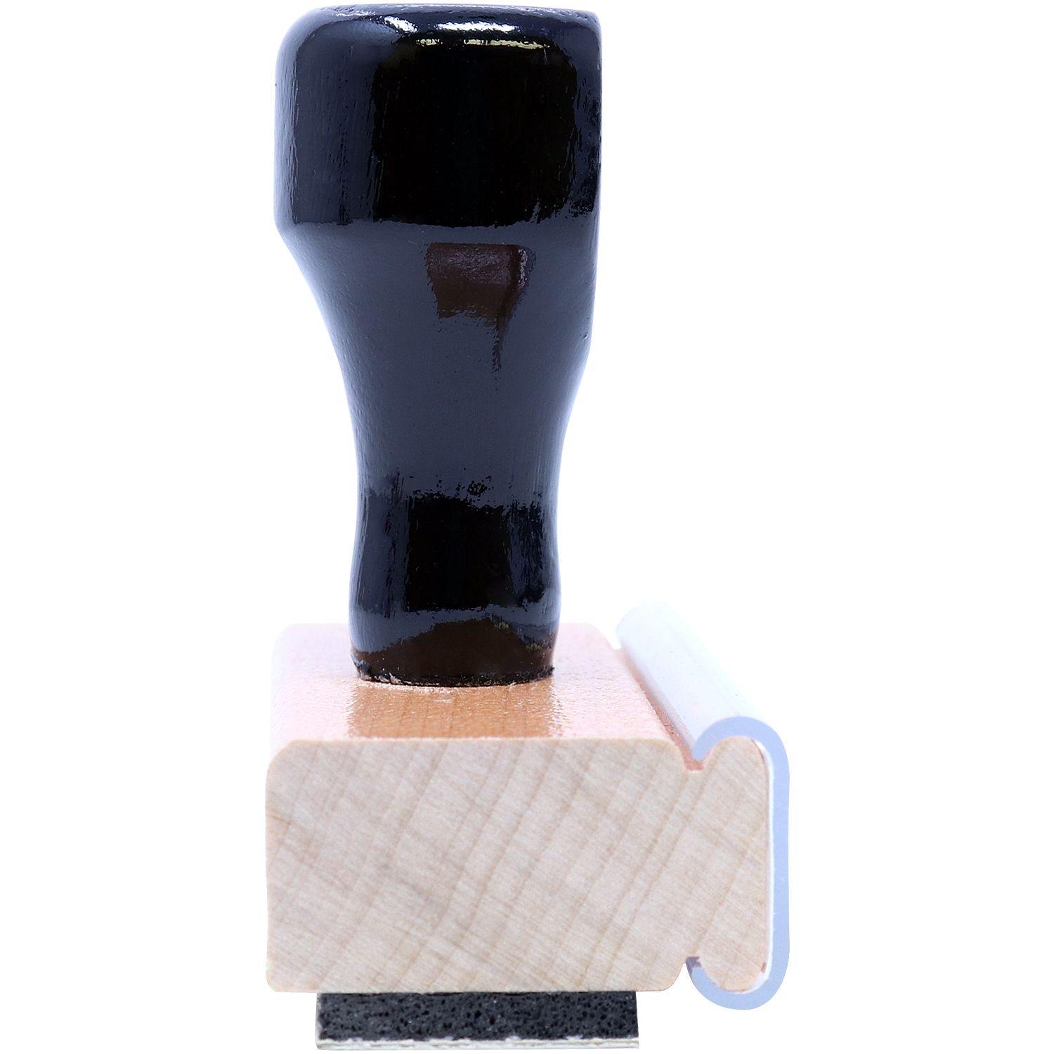 Regular Issued for Construction Stamp with a black handle and wooden mount, side view showing the rubber stamp base.