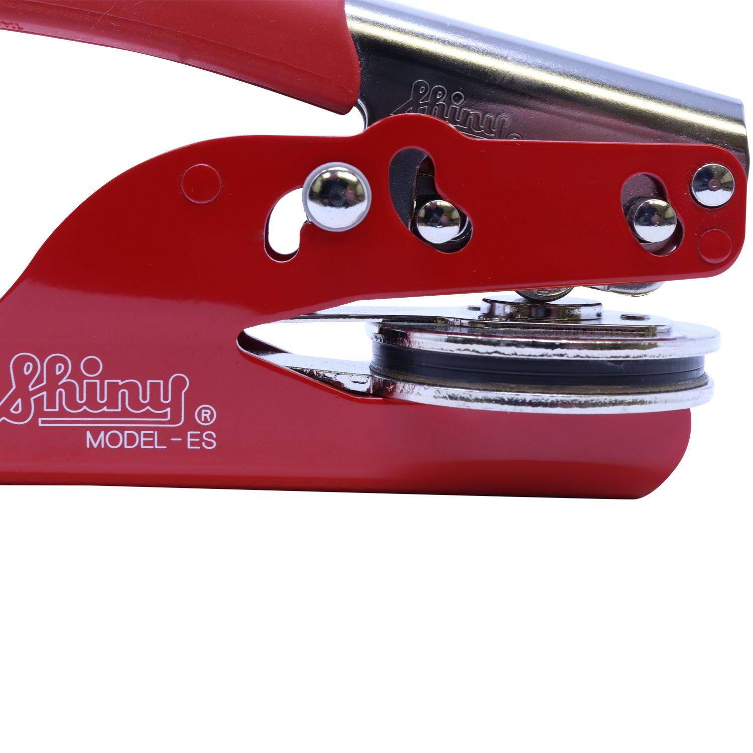 Close-up side view of the Architect Red Seal Handheld Embosser, showcasing its red handle and metal embossing mechanism with the Shiny Model-ES branding.