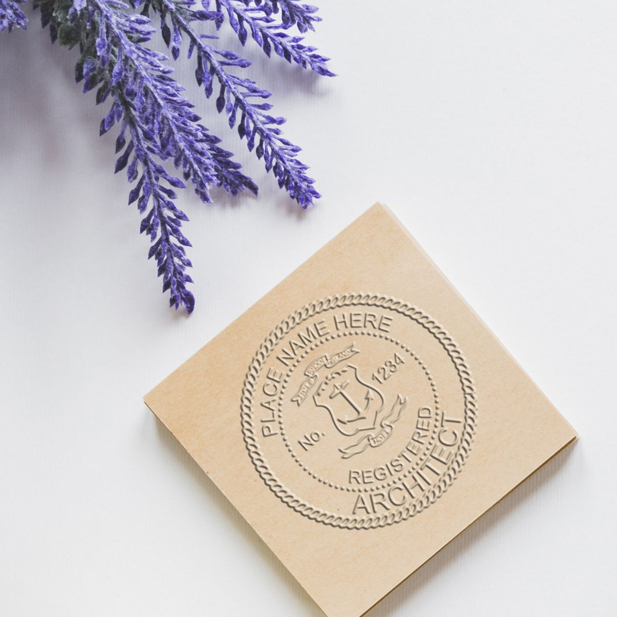 An in use photo of the Gift Rhode Island Architect Seal showing a sample imprint on a cardstock