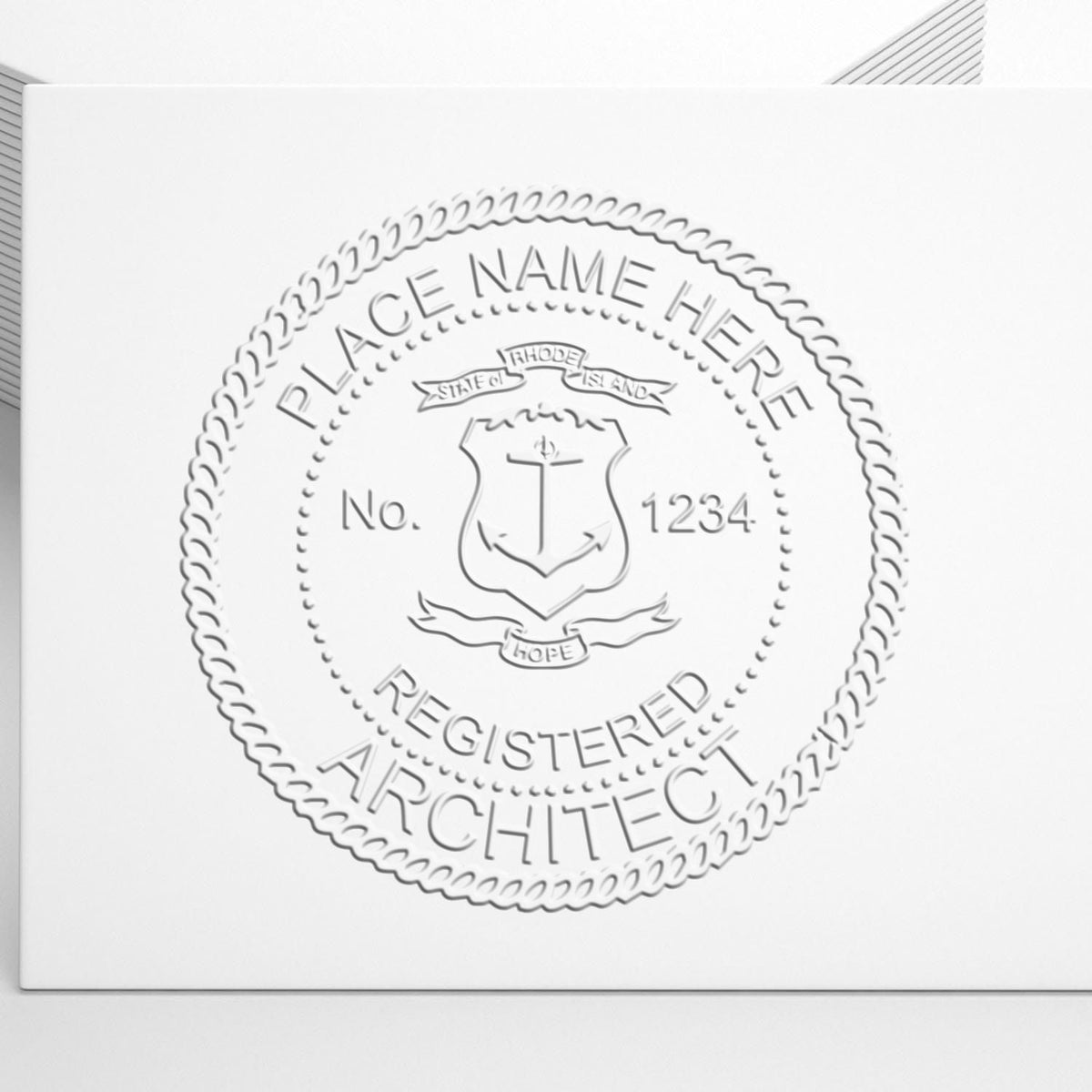 A lifestyle photo showing a stamped image of the Rhode Island Desk Architect Embossing Seal on a piece of paper