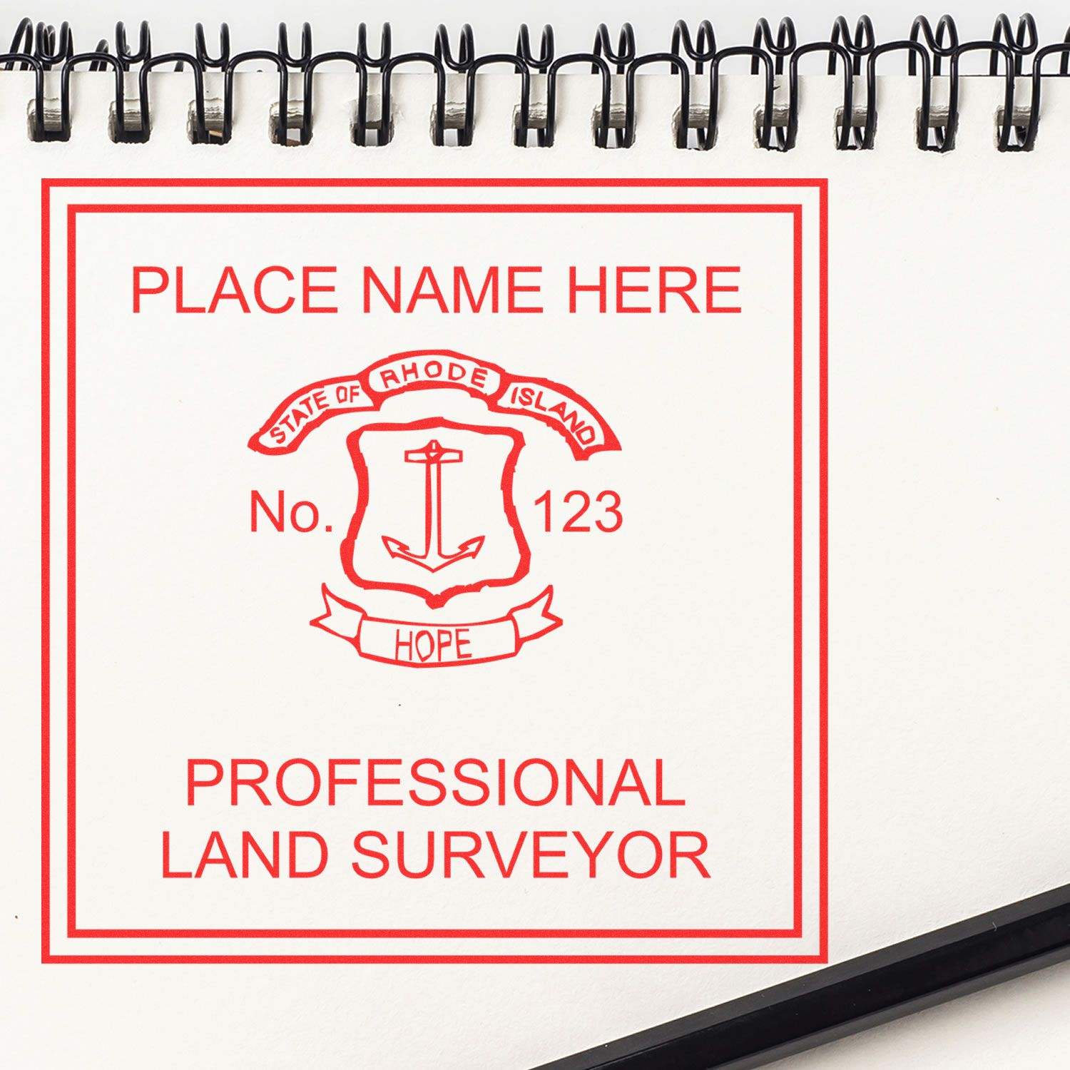 Digital Rhode Island Land Surveyor Stamp, Electronic Seal for Rhode Island Land Surveyor on a spiral-bound notebook.