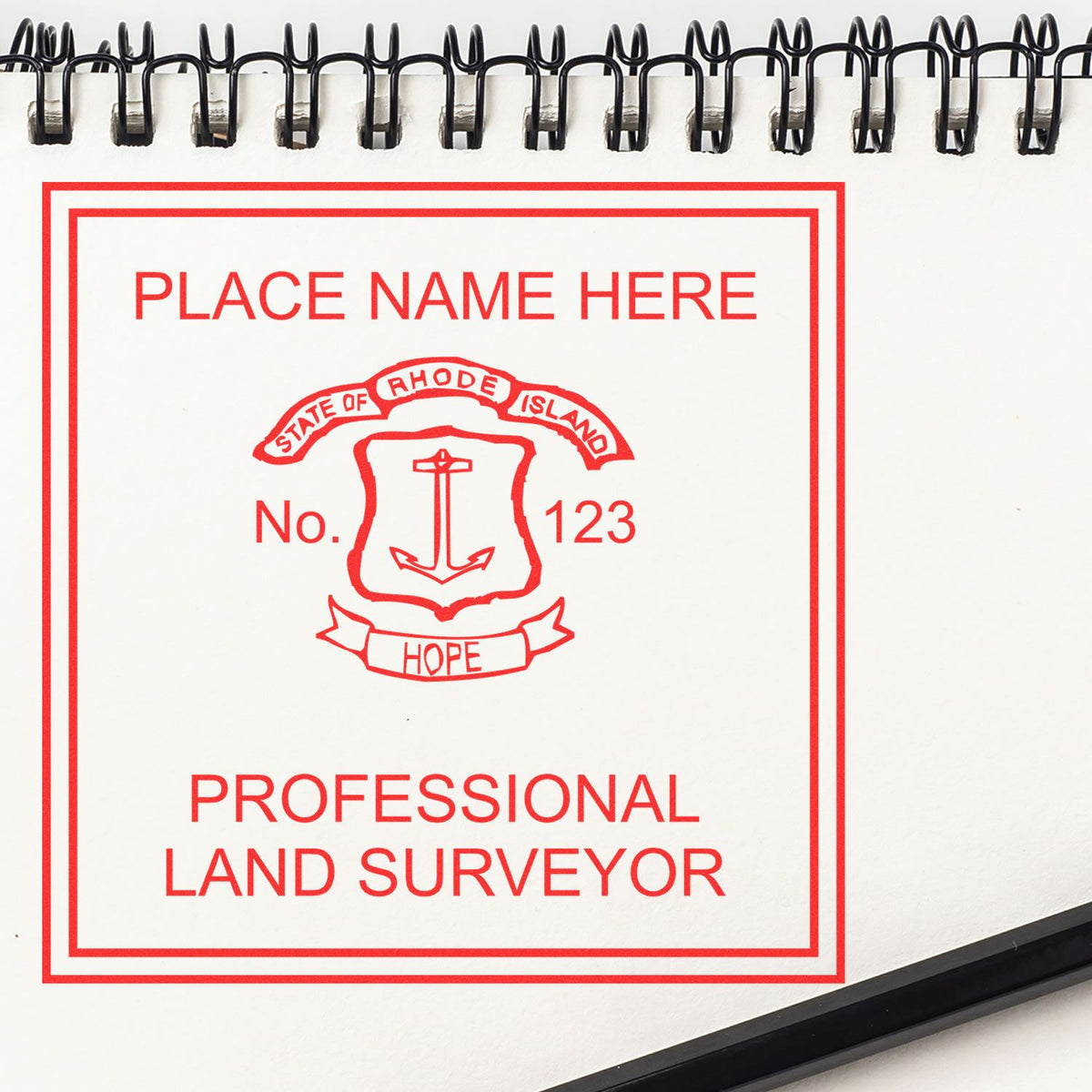 A lifestyle photo showing a stamped image of the Slim Pre-Inked Rhode Island Land Surveyor Seal Stamp on a piece of paper