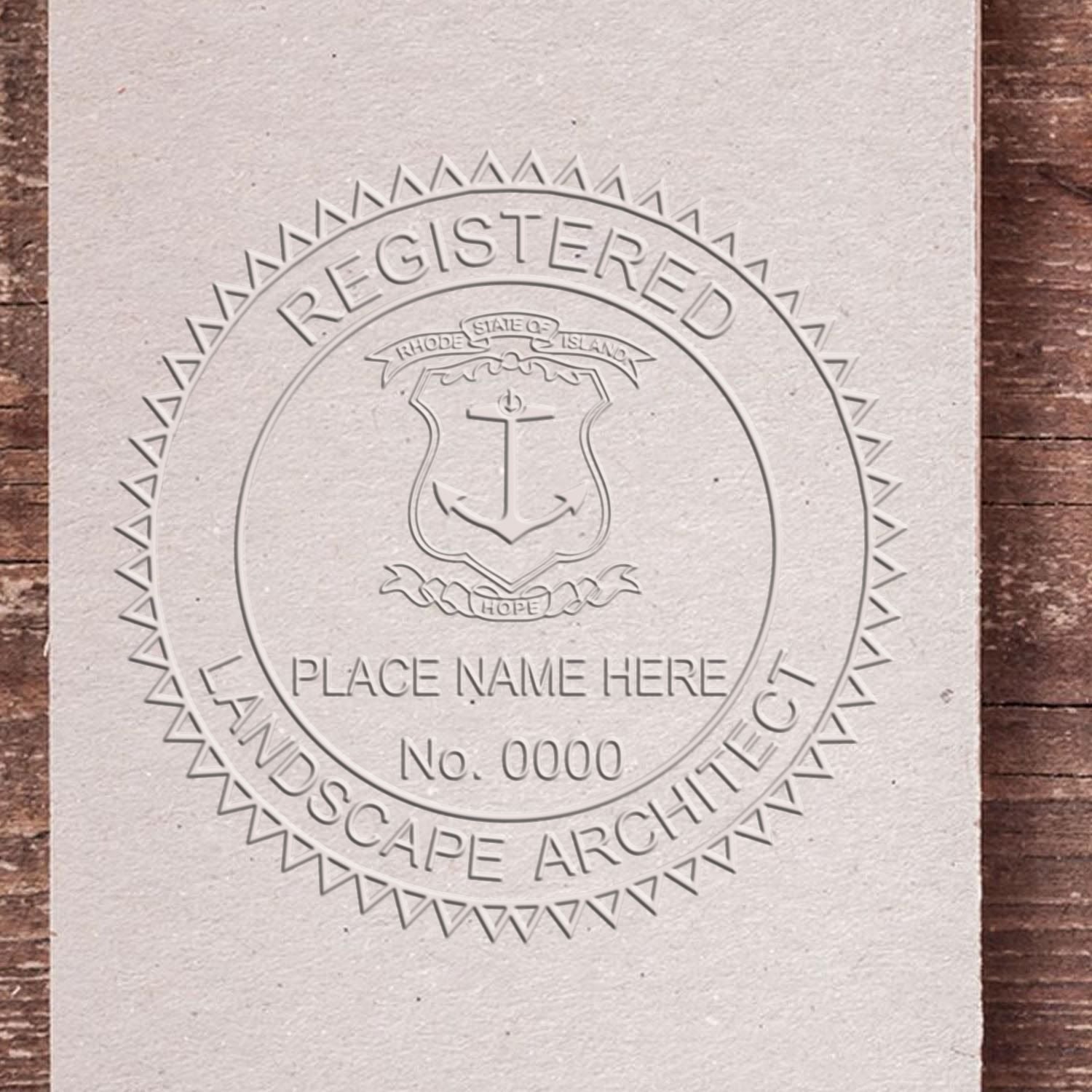 An in use photo of the Hybrid Rhode Island Landscape Architect Seal showing a sample imprint on a cardstock