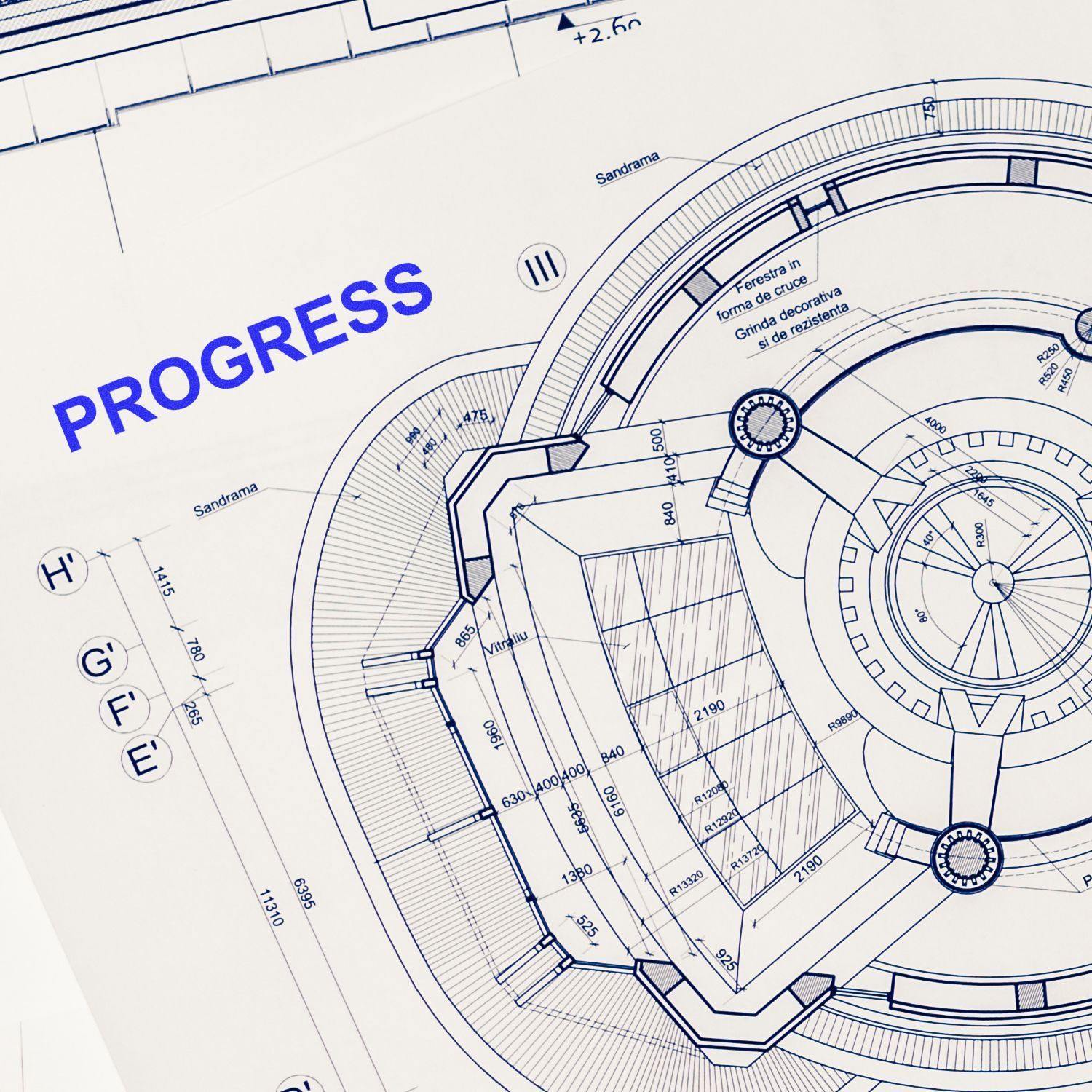 Blueprint with a PROGRESS mark stamped in blue ink using a Self Inking Progress Stamp, indicating ongoing development or completion.