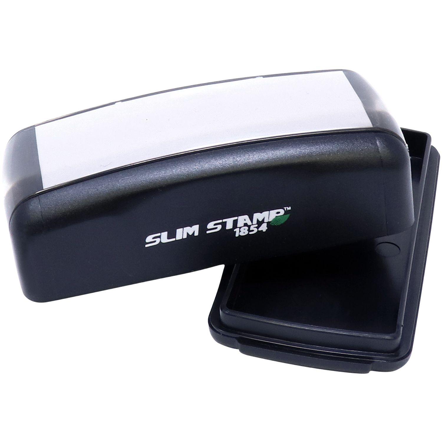 Large Pre-Inked Stay Safe Stay Healthy Stamp, black with a white top, shown with its lid removed and placed beside it.