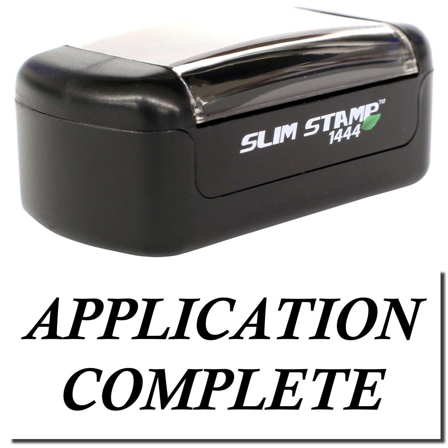 A stock office pre-inked stamp with a stamped image showing how the text APPLICATION COMPLETE is displayed after stamping.