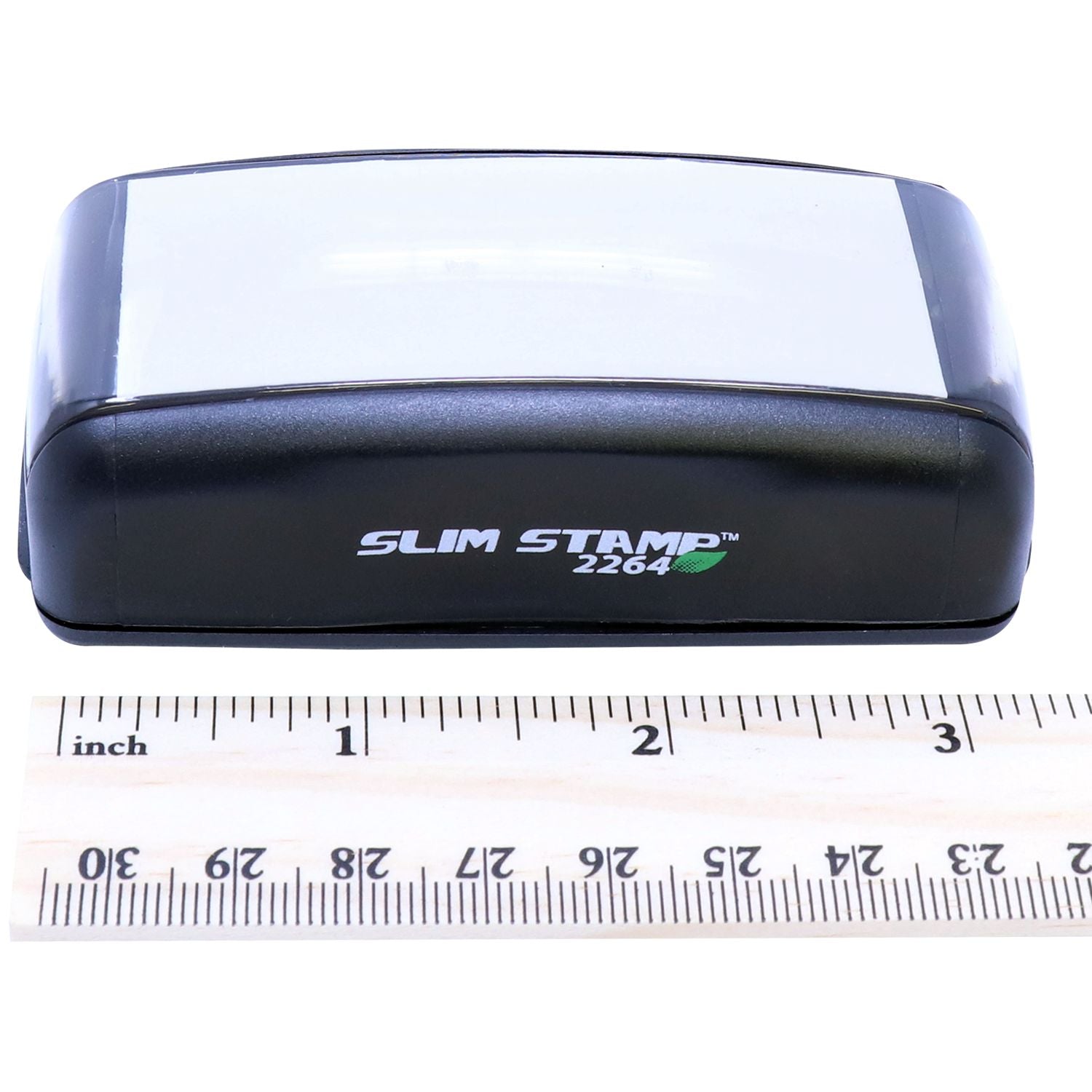 Slim Pre-Inked Stamp Identification Notary Stamp, black with a white top, placed next to a ruler showing its compact size.