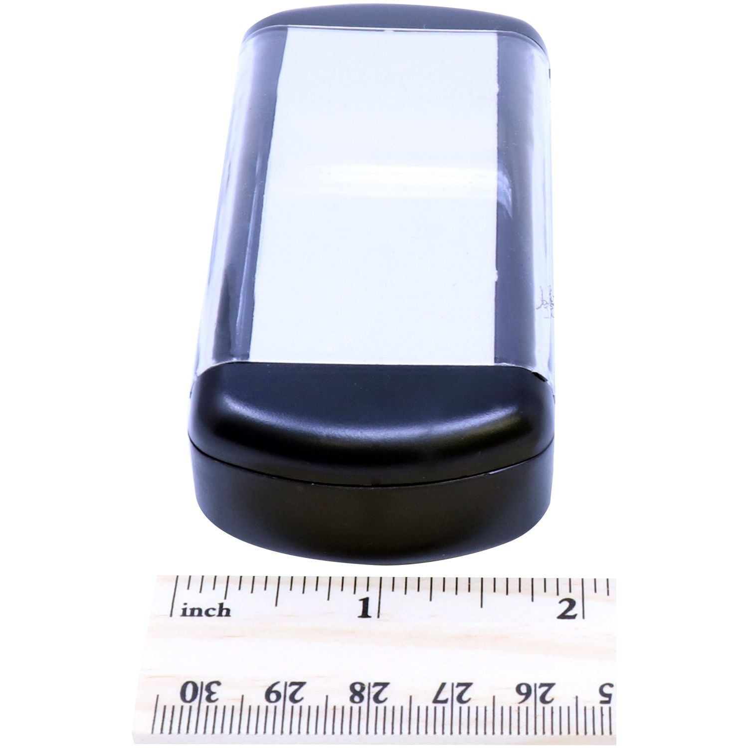 Slim Pre-Inked Notary Jurat Stamp shown next to a ruler for size comparison. The stamp is compact and rectangular with a black base.