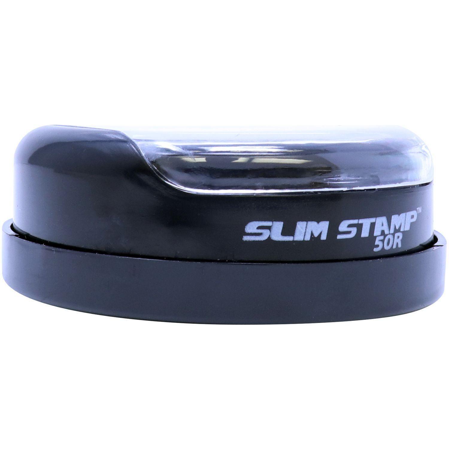 Forester Slim Pre-Inked Rubber Stamp of Seal, model 50R, shown from a front angle with a sleek black design and clear top cover.