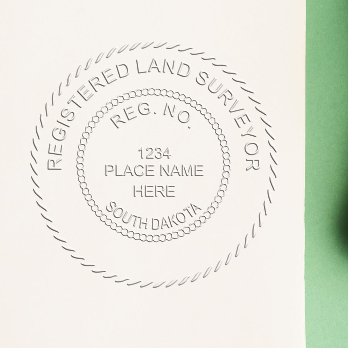 A lifestyle photo showing a stamped image of the State of South Dakota Soft Land Surveyor Embossing Seal on a piece of paper