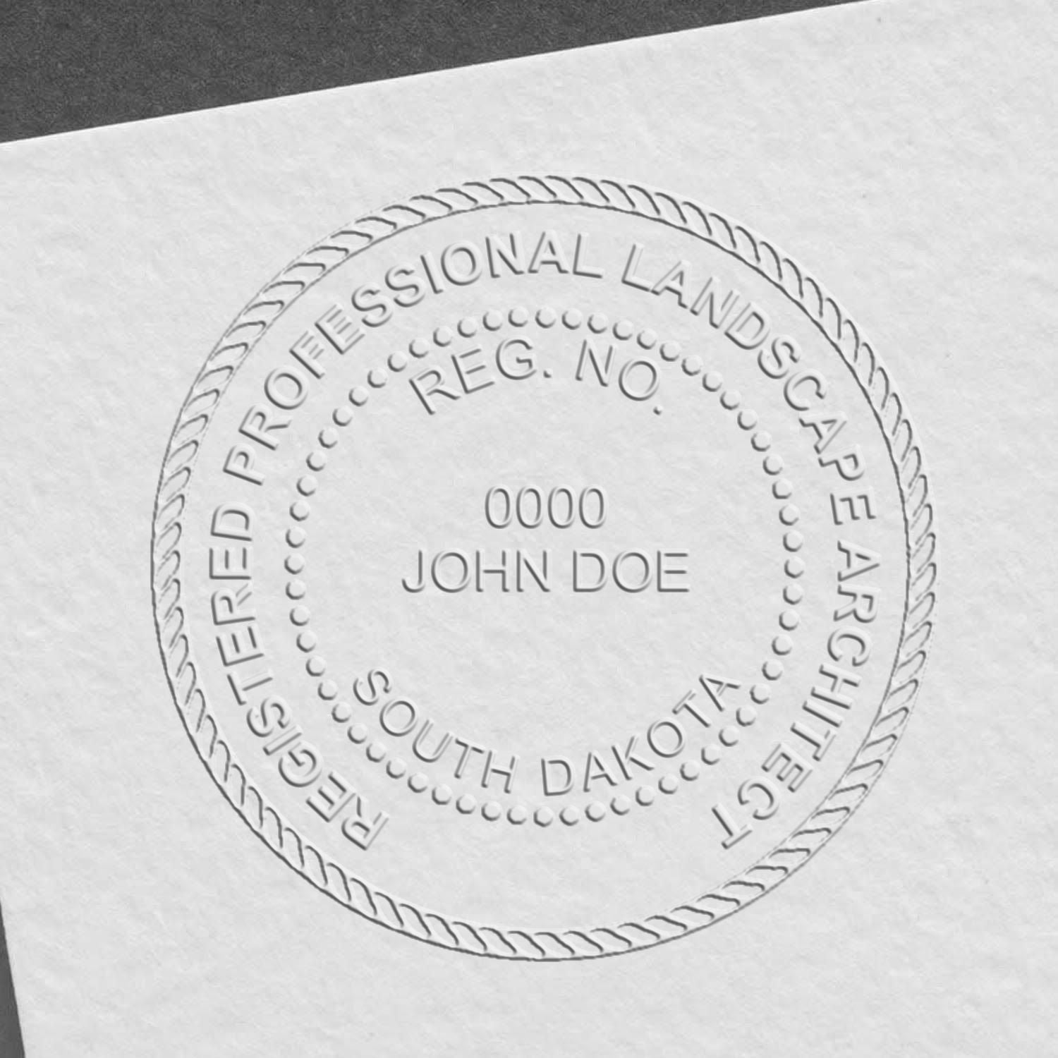 A stamped impression of the State of South Dakota Handheld Landscape Architect Seal in this stylish lifestyle photo, setting the tone for a unique and personalized product.