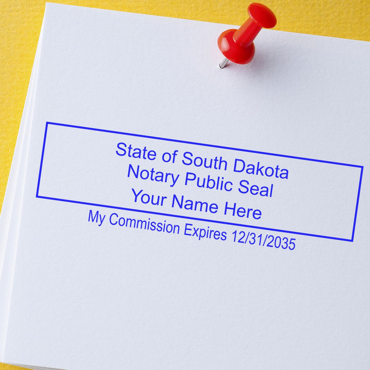 A lifestyle photo showing a stamped image of the Wooden Handle South Dakota Rectangular Notary Public Stamp on a piece of paper
