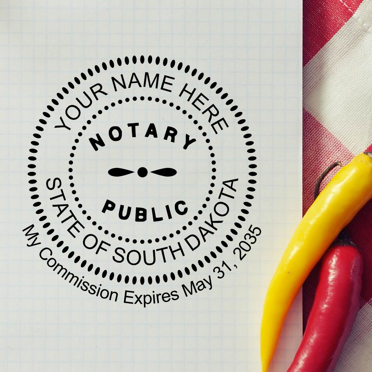 A lifestyle photo showing a stamped image of the Round South Dakota Notary Public Seal Stamp on a piece of paper