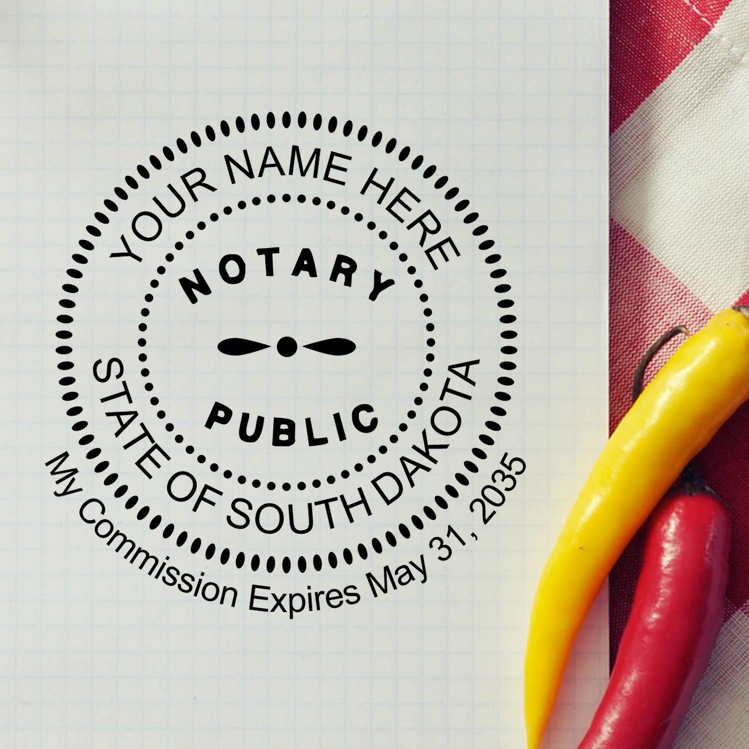 An alternative view of the Premium Pre-Inked South Dakota MaxLight Notary Public Stamp stamped on a sheet of paper showing the image in use
