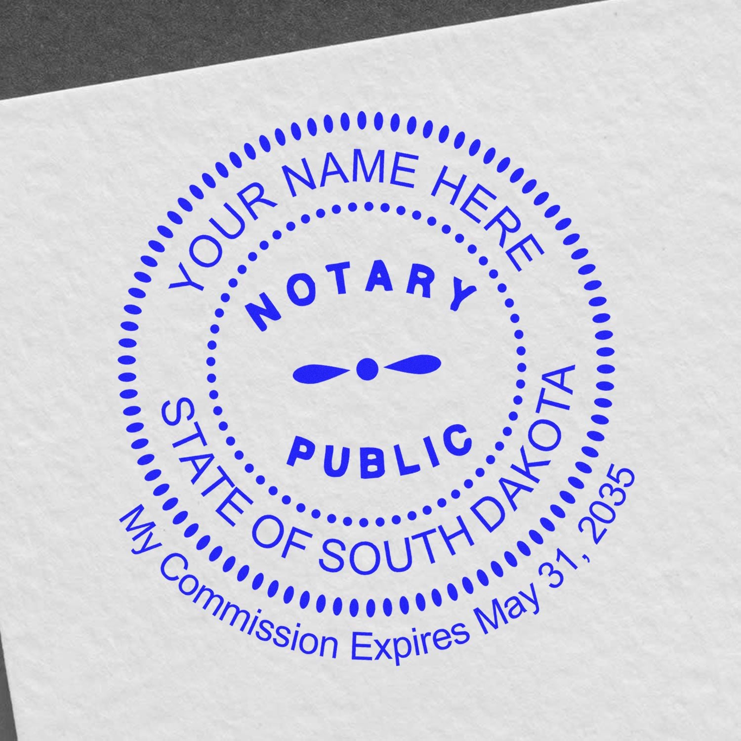 This paper is stamped with a sample imprint of the Round South Dakota Notary Public Seal Stamp, signifying its quality and reliability.