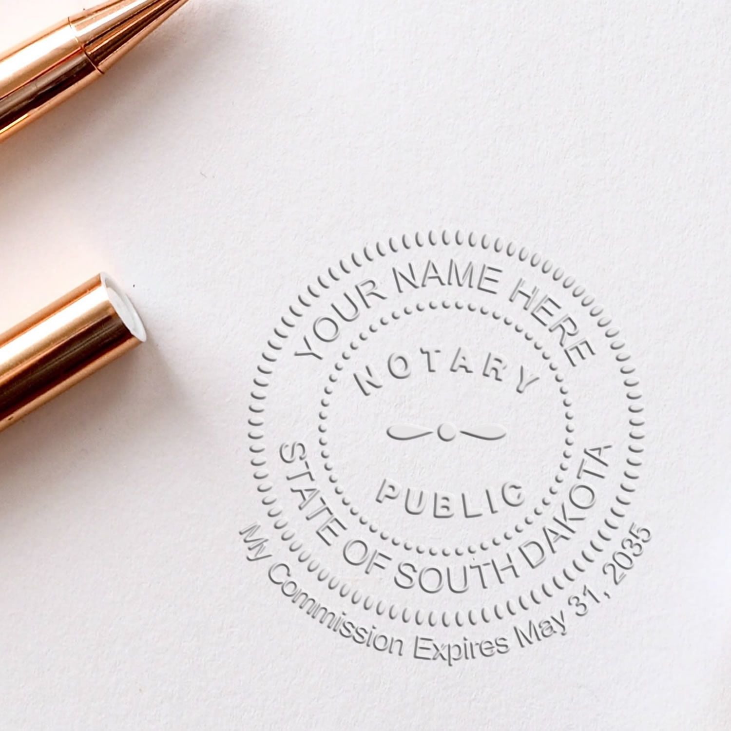 A stamped impression of the South Dakota Handheld Notary Seal Embosser in this stylish lifestyle photo, setting the tone for a unique and personalized product.