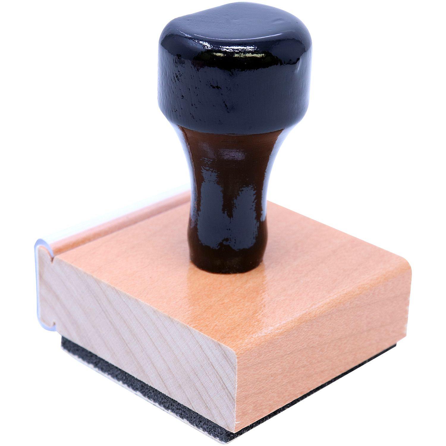 Forester Regular Rubber Stamp of Seal with a black handle and wooden base, shown from the back-right view.