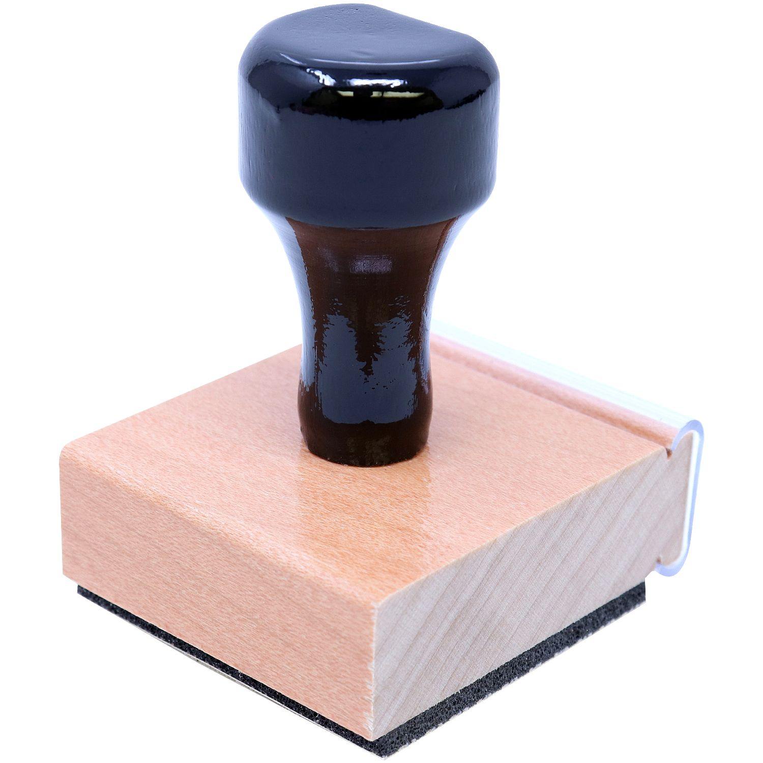 Interior Designer Regular Rubber Stamp of Seal with a black handle and wooden base, angled side view.